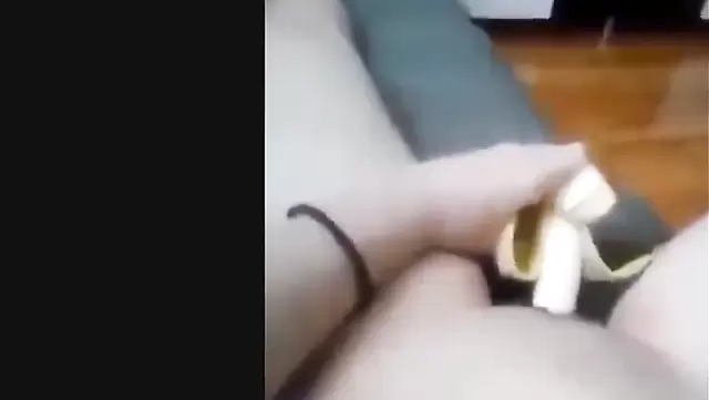 Horny Asian girl masturbating with banana